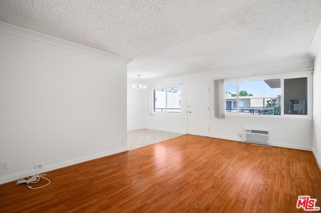 Building Photo - 7548 Hampton Ave Unit 304