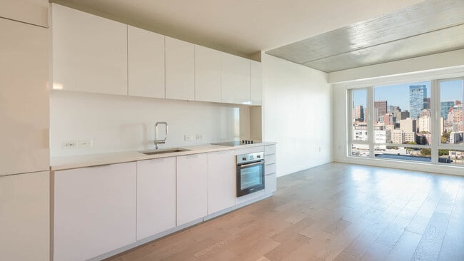 Kitchen with Paneled Appliances and Quartz Countertops