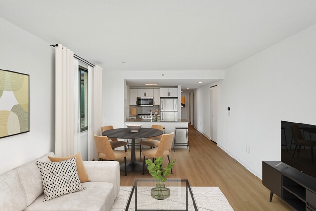 Renovated Package I dining and living room with hard-surface flooring