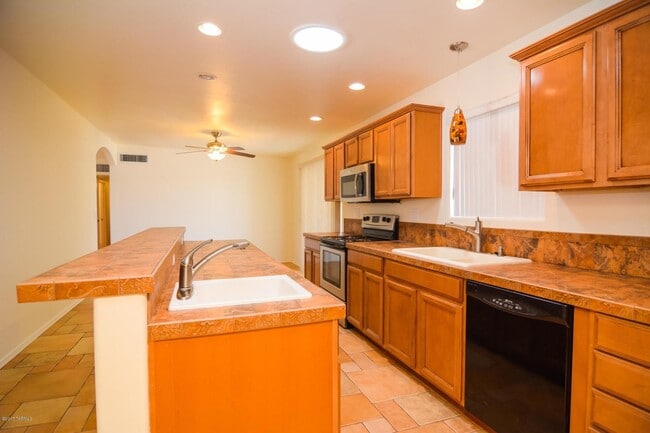 Photo - Spacious 4BR/2BA Tucson Home | Modern Tile Floors & Private Fenced Yard