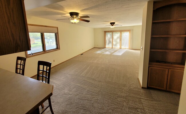 Large sunny living room - 1711 W Koch St Unit Cedarwinds #34