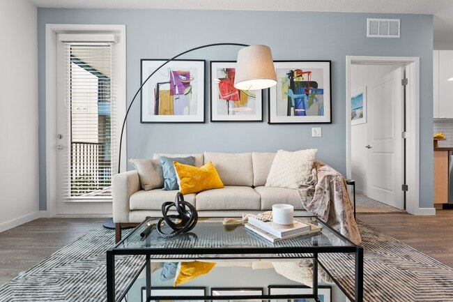 Living Room with Sleek Hardwood-Style Flooring - Gateway at Pinellas Apartments