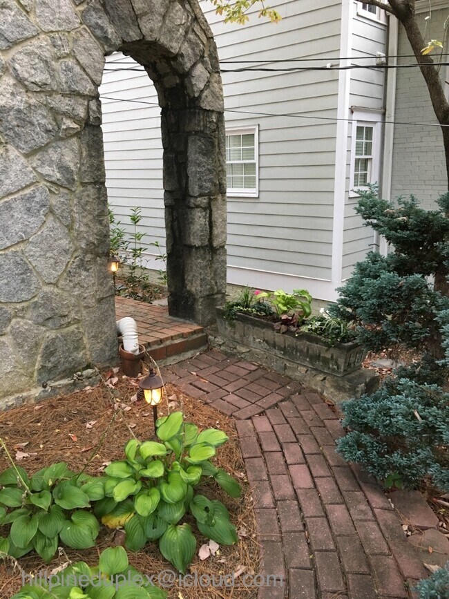 Private entrance through unique stone archway - 629 Hillpine Dr NE
