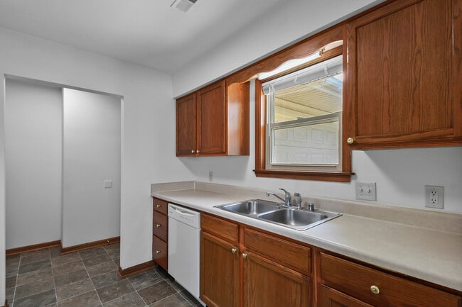 Kitchen with Sink, Dishwasher, Window to Driveway