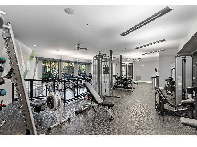 24/7 fitness center with cardio and strength training equipment