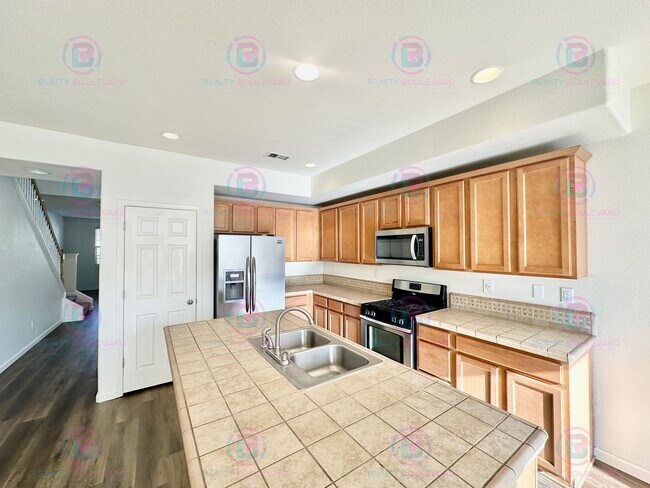 Photo - Spacious 4-Bedroom 3 Bath, 3 Car Garage Home with Loft, Living Room and Family Room Outdoor Kitch...