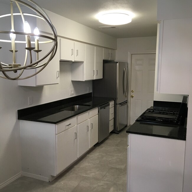 Large kitchen with walk-in pantry. All new appliances, new granite counters, new disposal, new sink. - 8604 Willowick Drive