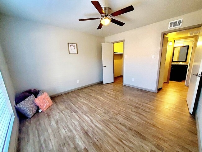 Renovated bedroom - The Oaks Apartments