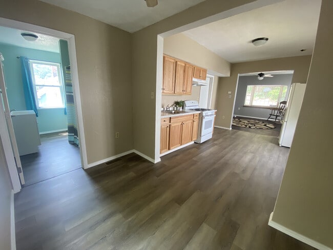 Bathroom, Kitchen with Bonus Space, Living Room (bedroom behind the closed door off of kitchen) - 132 Clara St Apartments Unit 1