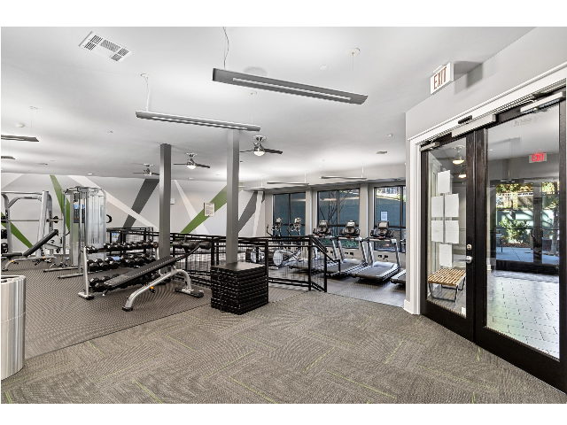 24/7 fitness center with cardio and strength training equipment