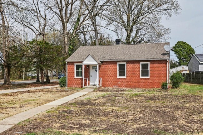 Photo - Renovated 3-Bedroom Home with Spacious Yard & Detached Garage