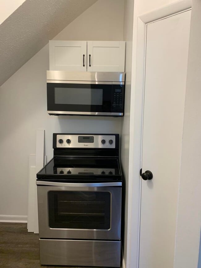 Newly installed above range SS microwave Pantry w/ new shelving - 1619 Mansfield St Unit #1