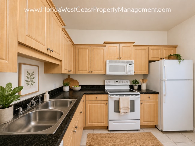 Photo - MOVE IN READY! 2 BEDROOM/2 .5 BATH - 1 CAR GARAGE! NEW LVP FLOORING IN LIVING! SUPER LOCATION!