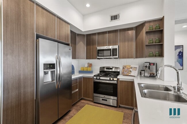 Kitchen with Energy-Efficient Appliances and Ample Cabinet Storage - Cole Grove by Wiseman