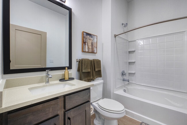 Bright bathroom with modern finishes and ample storage at Sageland Flats at Brooks