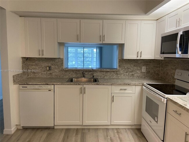 Building Photo - 12601 SW 13th St Unit 403G Rental