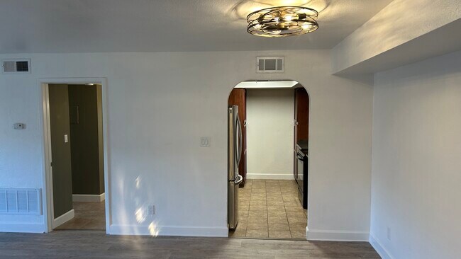 Large living space w new ceiling fans and light fixtures