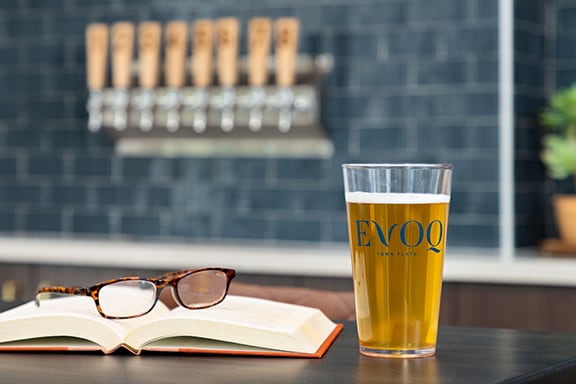 Enjoy a beverage from the on-site taps. - Evoq Johns Creek