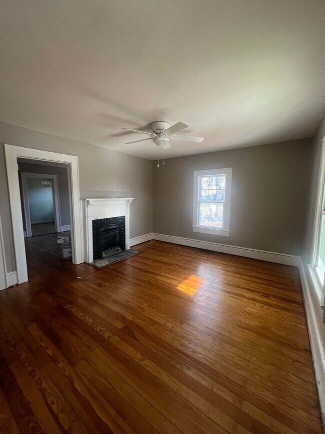 Photo - Hardwood floors and front porch