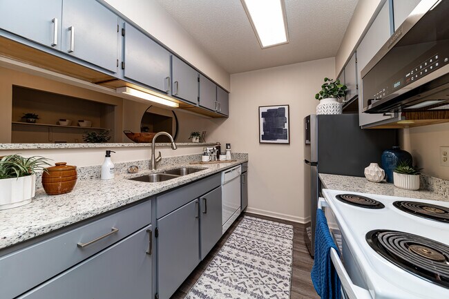 Kitchen with granite counters and modern cabinetry