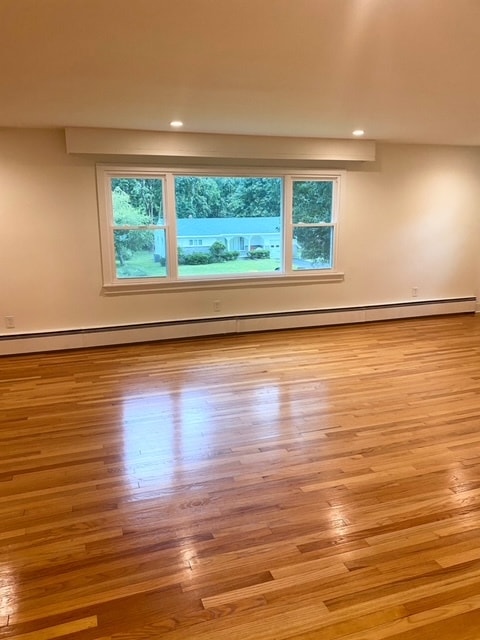 Picture window in living room, beautifully-refinished hardwood floors - 3 Alton Rd