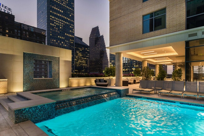 City lights meet twilight luxury — an urban oasis glowing with nighttime elegance. - Aris Market Square