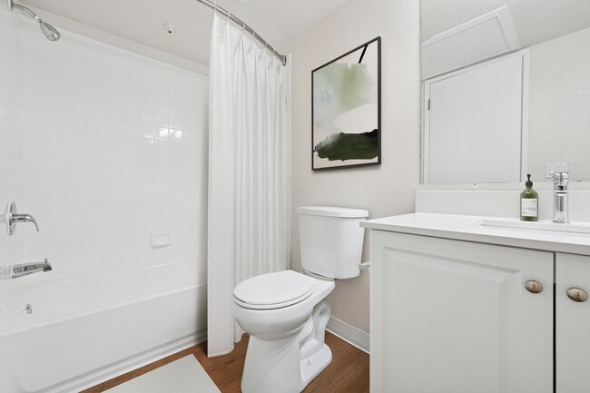 Renovated Package I bath with quartz countertop and hard surface flooring