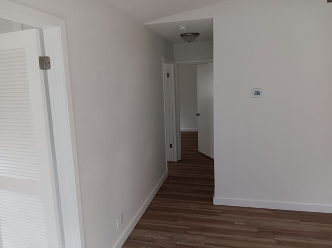 Hallway to bedrooms and bath.