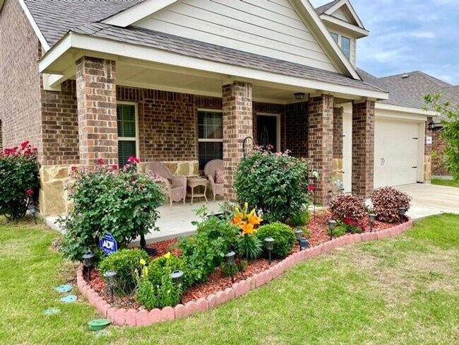 Photo - Elegant four-bedroom corner-lot home with hardwood floors, modern kitchen, master suite, and comm...