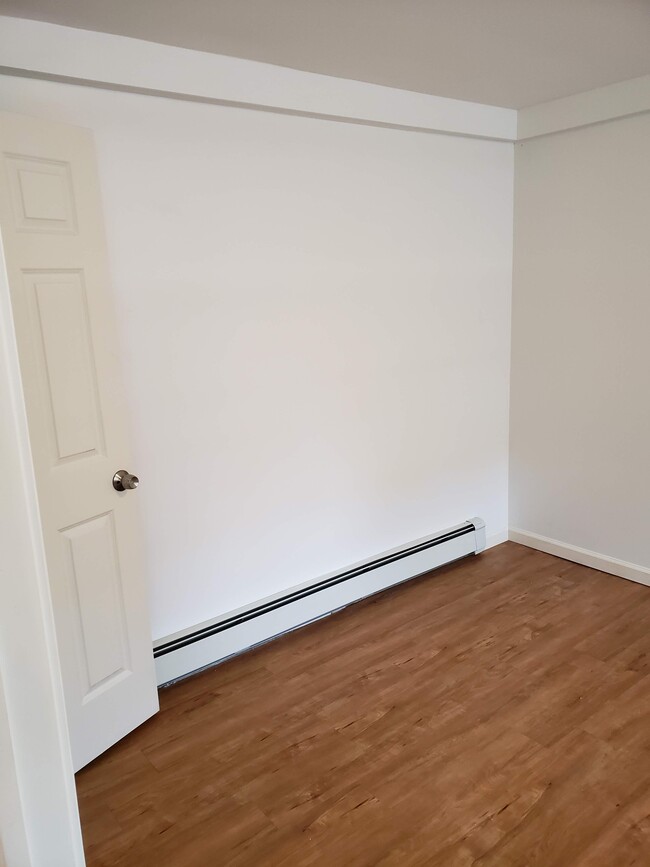 Bedroom. Measures approx 15 ft x 10 ft. Two closets. Three windows. - 2 Judson St Apartamentos Unidad Ground Level,  1