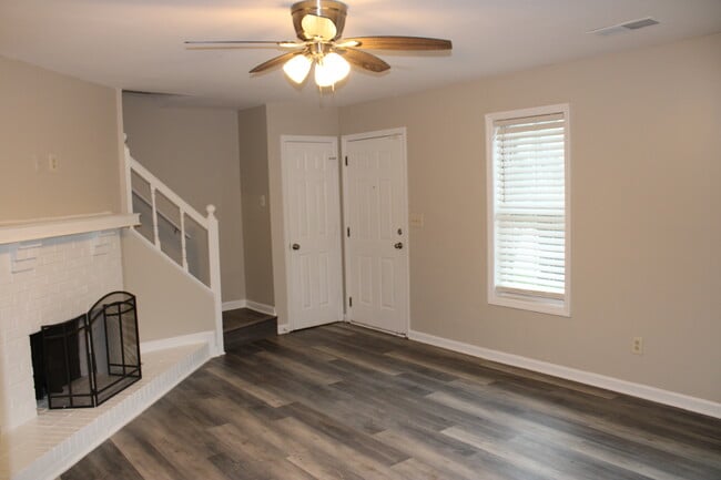 Livingn room with stairs closet and front door - 915 Joseph club dr