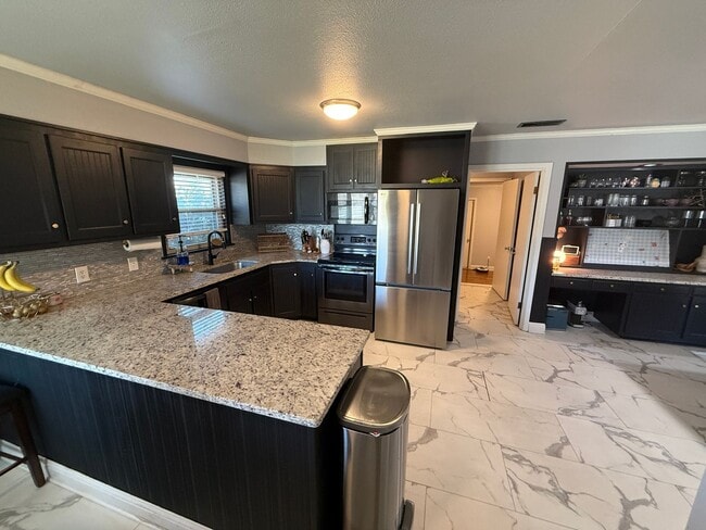 Photo - PRE LEASING for Fall 2026! 5 bedroom 3 bath Home!