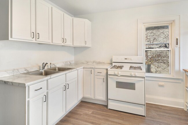 Spacious, open-concept kitchen with modern updates. - 1534 N Marshall St House Unit 2nd Floor - 1534A