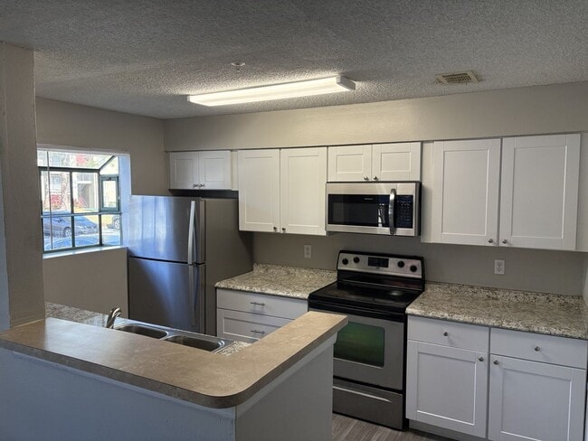 Photo - 1st floor unit with fire place and large patio