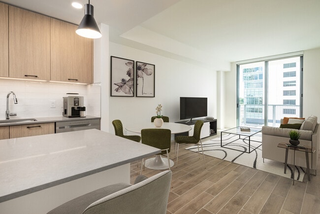 Dining and living room with hard surface flooring