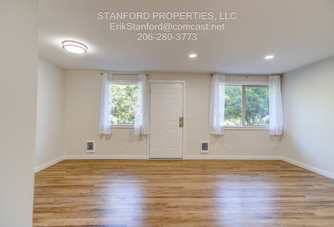 Front entry, living, and dining rooms. - 8741 Seward Park Ave S Apartments Unit 2