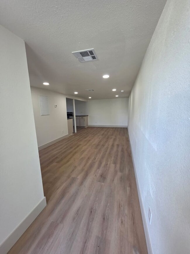 Photo - Studio Apartment with bathroom, kitchen & utility area on the lower level of property.