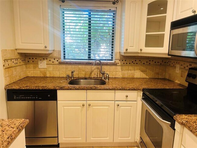 Building Photo - 1205 S Flagler Ave Unit 402