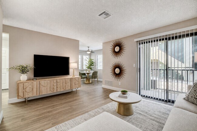 Elevate your lifestyle at Shelter Cove with a sunlit living space featuring modern decor and stylish furnishings. Enjoy the seamless flow from indoor comfort to outdoor views. Visit us today to see your new home!
