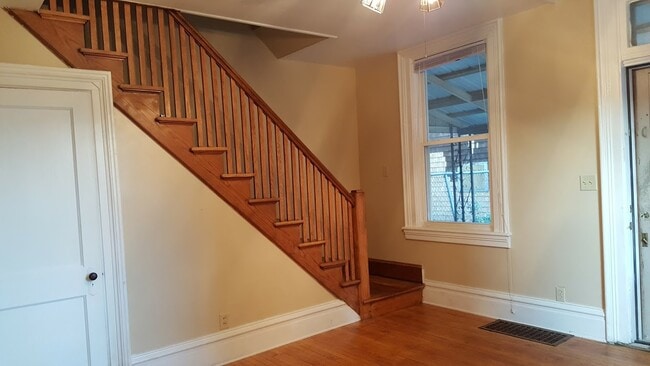 Living rm & stair railing - 404 W Court St House