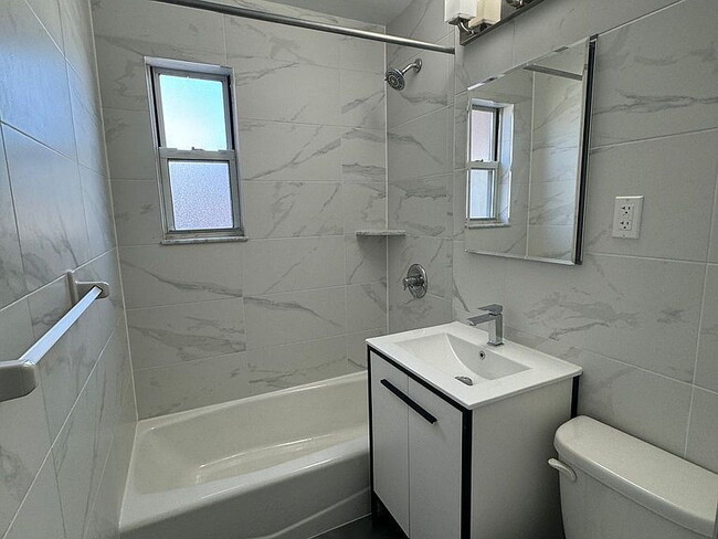 Photo - "Charming 3-Bed Oasis in Oakland Gardens with Modern Granite Touches!"