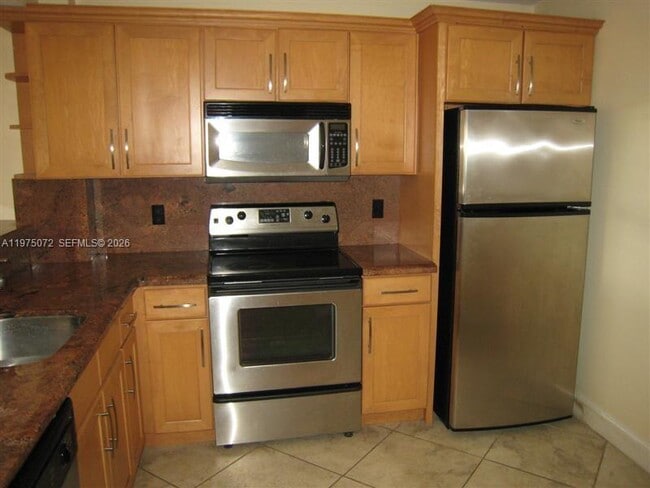 Building Photo - 7722 Camino Real Unit E301