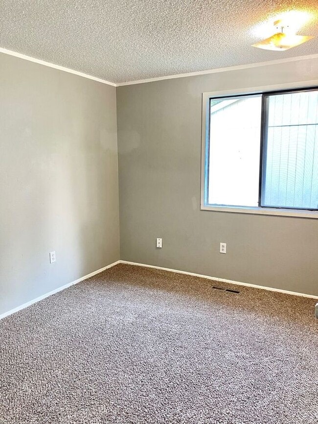 Photo - Spacious 3 Bedroom 1 Bath Duplex in South Loveland with Huge Fenced Backyard & 2-Car Garage!