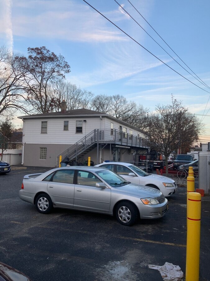 Second story apartment with entrance from front and back - 1225 River Ave Apartments Unit River 1 plaza