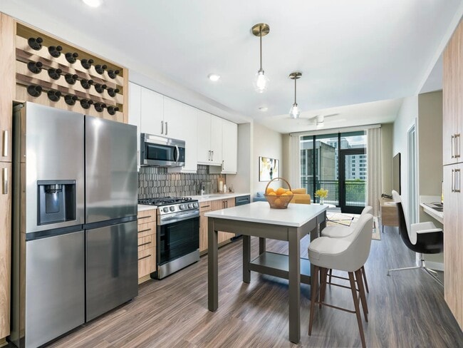 Experience the epitome of luxury living at Modera Parkside! Our premium collection homes showcase under-cabinet kitchen lighting, distinct bathroom and kitchen fixtures, upgraded countertops, and a stunning tile backsplash, all highlighted by a unique two-tone cabinet finish package. - Modera Parkside