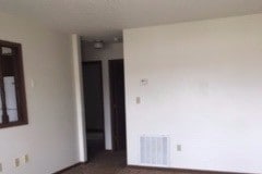 Living room with carpet - 104 Harold Blvd