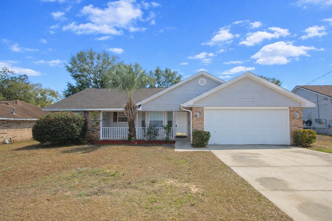 Building Photo - 3BR/2BA Brick Home with Vaulted Ceilings, Open Living Areas, 2-Car Garage & Fenced Backyard Near ...