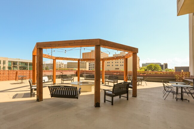 Enjoy some down time on our 4th floor lounge area on the roof of the parking garage. - The Regency Apartments