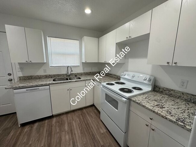 Photo - Spacious and updated 2 bedroom 2 bathroom apartment for rent. Central heat and air, granite count... Unit a