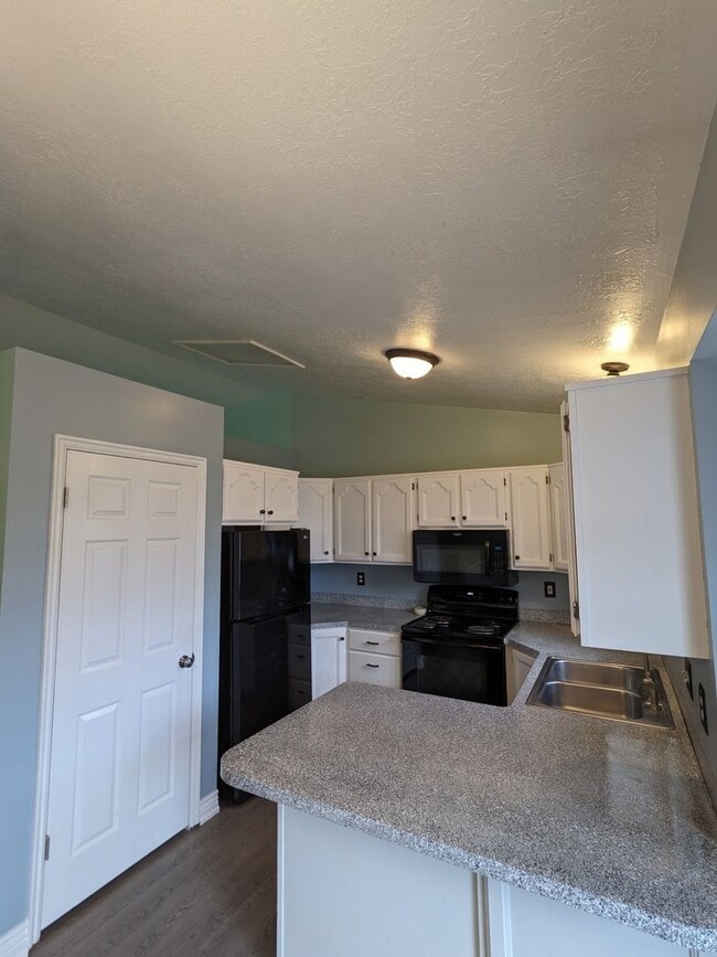 Photo - Spacious 5-Bed Clearfield Home with Garage & Fenced Yard